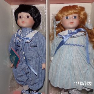 Product Image and Link for TWO MARIAN YU DESIGNS PORCELAIN GIRL AND BOY DOLLS 14″ Vintage MYD Inc