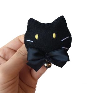 Product Image and Link for Pair of Black Kitty Cat Hairclips with a Bow and Bell