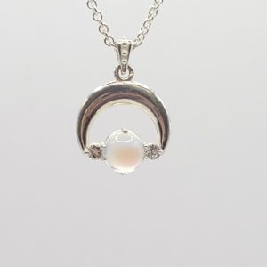 Product Image and Link for Crescent Moon Necklace in silver with round moonstone
