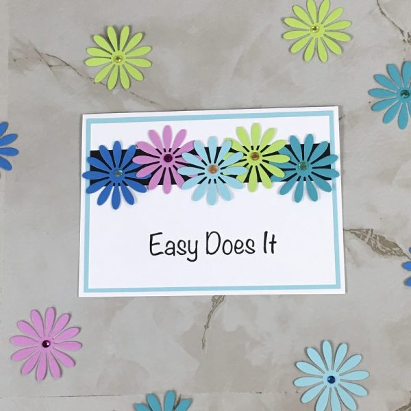 Product Image and Link for Daisy Slogan Greeting Card Easy Does It