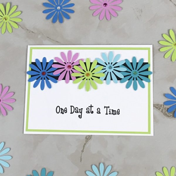 Product Image and Link for Daisy Slogan Greeting Card One Day at a Time