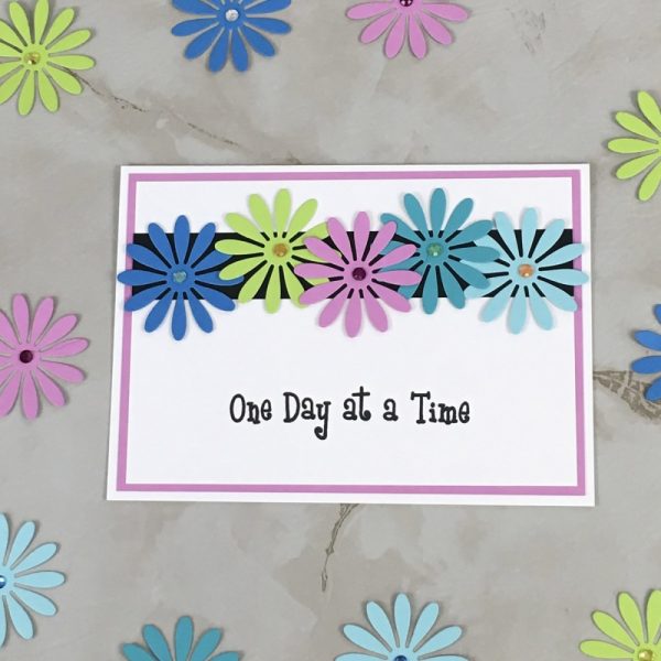 Product Image and Link for Daisy Slogan Greeting Card One Day at a Time