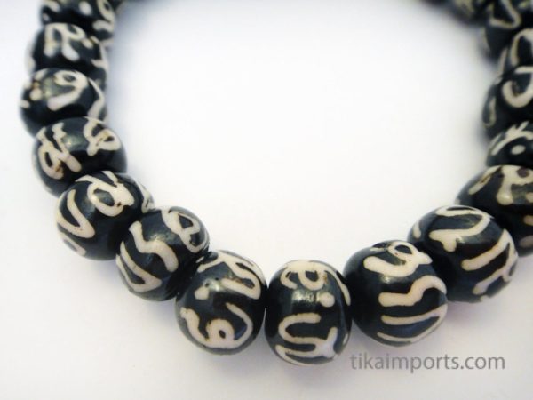 Product Image and Link for Carved Bone Batik Om Mala Bracelet