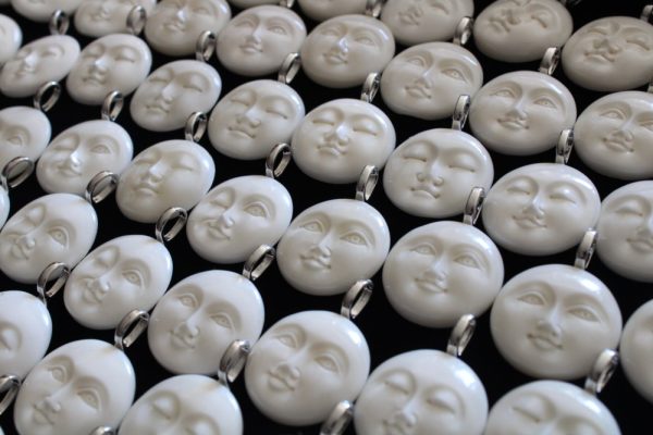 Product Image and Link for Carved Bone Moon Face Pendant