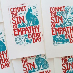 Product Image and Link for “Commit the Sin of Empathy Every Day” Woodblock Print (2 Designs)