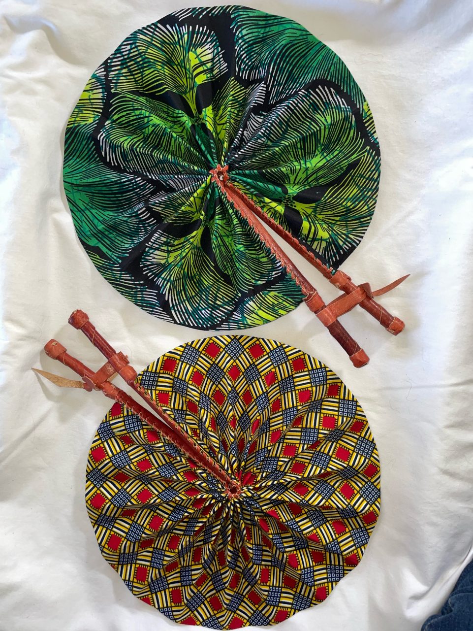 DESIGNS D1 OR D2: Bright African Kente folding fans w/ Leather Handles