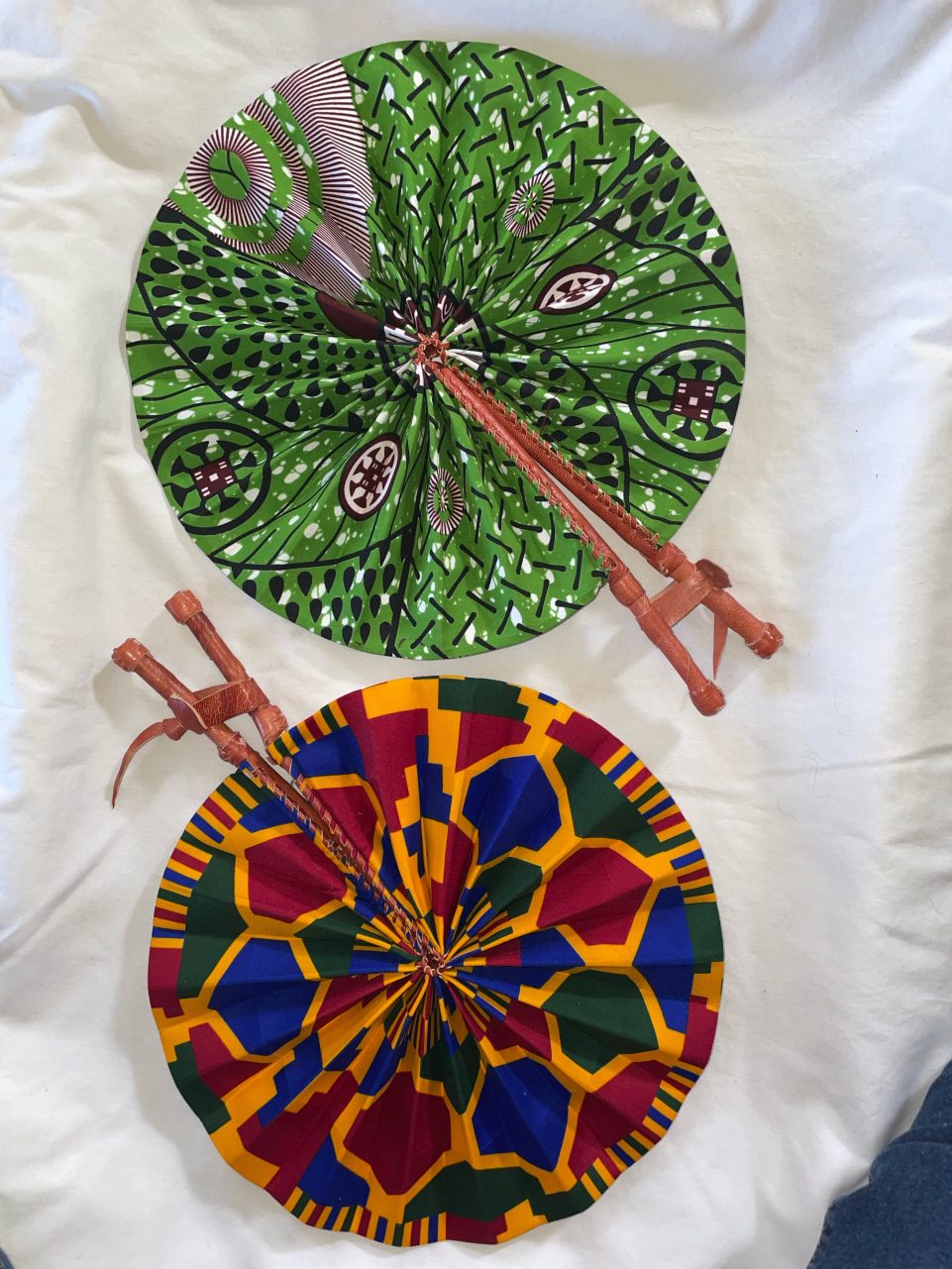 DESIGNS E1 OR E2: Bright African Kente folding fans w/ Leather Handles