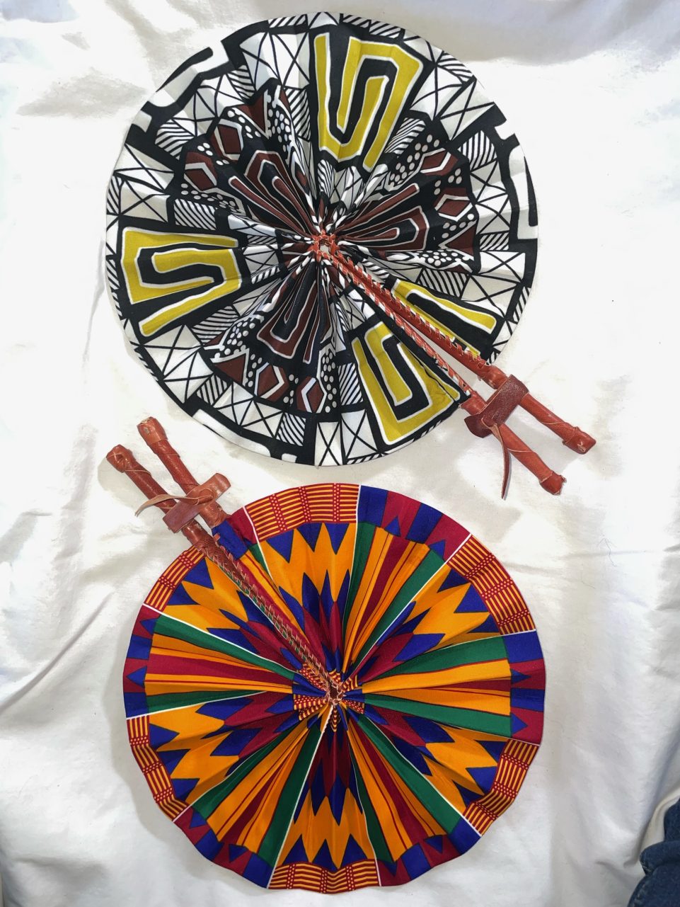 DESIGNS H1 OR H2: Bright African Kente folding fans w/ Leather Handles