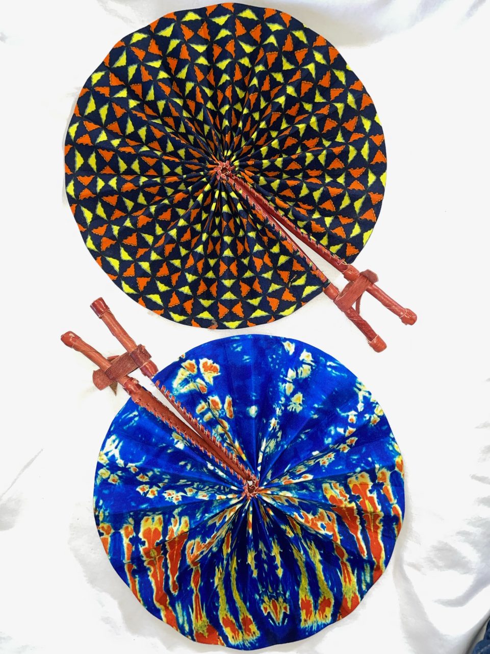 DESIGNS B1 OR B2: Bright African Kente folding fans w/ Leather Handles